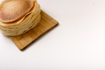 stack of pancakes on the board, copy space