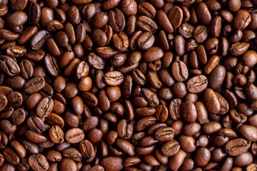 Roasted coffee beans background. Close up