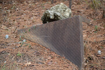 Rusted metal slab resting ag