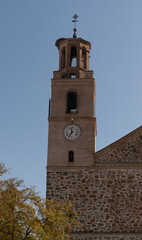 Fototapeta premium front view of the tower of the san juan bautista de urda parish, toledo, spain