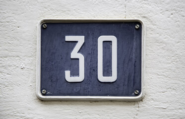 Number thirty on a facade