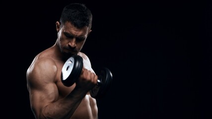 Obraz na płótnie Canvas Fit and sporty bodybuilder over black background. Sportsman in studio. Sport and fitness concepts.