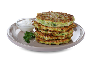 Delicious zucchini fritters with sour cream on white background