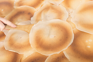 pancakes background and wooden spatula, copy space