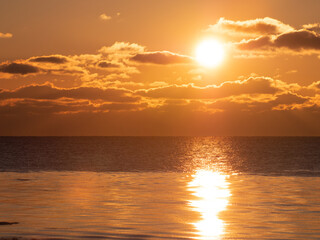 Cold winter sea shore at sunset. The sun went down