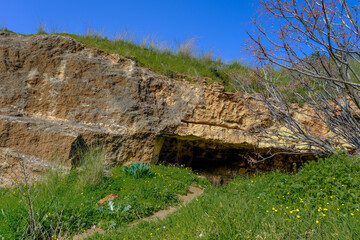 View of a large, deep kurkar sandstone cave in Poleg Nature reserve, located in coastal plain...
