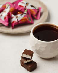 Chocolate and chocolate candy. Different chocolates and candies for coffee and tea.
