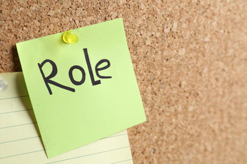 Green paper with word Role pinned to corkboard. Space for text