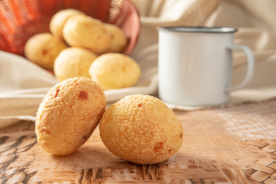 Cheese bread from Brazil, Arrangement with cheese bread, fabric and accessories on a table, selective focus.