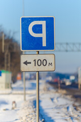 Road signs for drivers on the road, on a winter sunny day