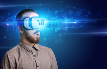 Businessman looking through Virtual Reality glasses with DIGITAL LIFE inscription, cyber security concept