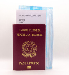 Covid-19 travel kit, including passport, certificate of vaccination and a surgical face mask