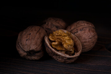 Chopped walnut on a dark background. 