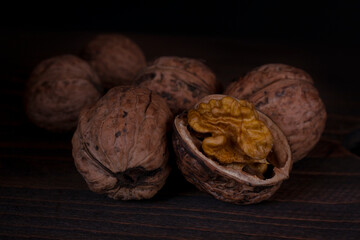 Chopped walnut on a dark background. 