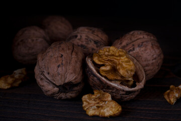 Chopped walnut on a dark background. 