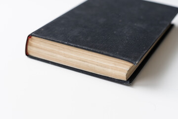 The book with a white cover on white background