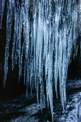 Fascinating ice formations and icicles called Brtnicke ice falls,CZ ledopady, in Bohemian Switzerland National Park, Czech republic.Winter trip to Valley of Wolfs creek,Vlci potok.Natural scenery