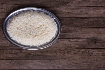 Cooked white rice. Horizontal gastronomic photography with space for texts. Popular food.