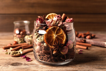 Aroma potpourri with different spices on wooden table