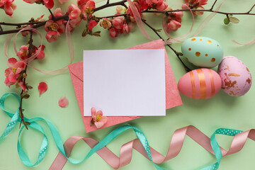 Easter greeting card mockup. spring flowers, willow twigs and Easter eggs. space for text 