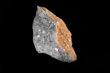 white mineral with darker side