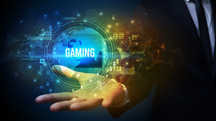 Elegant hand holding GAMING inscription, digital technology concept