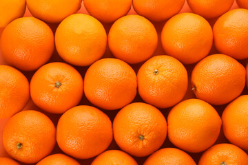 Fresh ripe oranges as background, top view