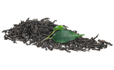 Pile of dried black tea with fresh green leaves isolated on a white background