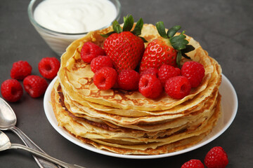 Russian cuisine national dish bliny with fresh berries	