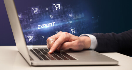 Businessman working on laptop with EXPORT inscription, online shopping concept