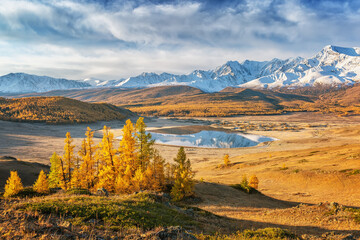 Mountain lake with autumn yellow trees, Altai