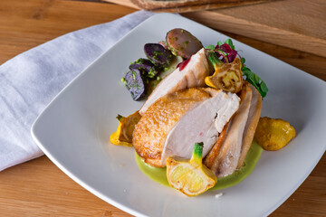 Chicken breast. Chicken pan seared to a crispy golden brown in brown butter and served with fresh organic vegetables: carrots, Brussels sprouts and green beans. Classic American restaurant favorite.