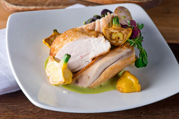 Chicken breast. Chicken pan seared to a crispy golden brown in brown butter and served with fresh organic vegetables: carrots, Brussels sprouts and green beans. Classic American restaurant favorite.