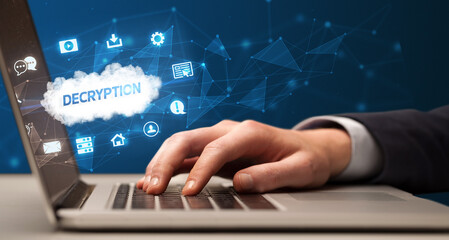 Businessman working on laptop with DECRYPTION inscription, modern technology concept