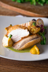 Chicken breast. Chicken pan seared to a crispy golden brown in brown butter and served with fresh organic vegetables: carrots, Brussels sprouts and green beans. Classic American restaurant favorite.