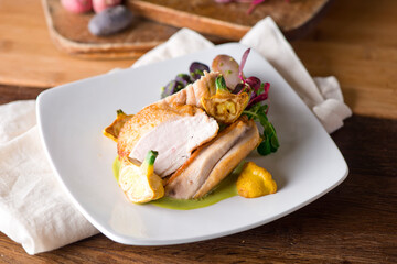Chicken breast. Chicken pan seared to a crispy golden brown in brown butter and served with fresh organic vegetables: carrots, Brussels sprouts and green beans. Classic American restaurant favorite.