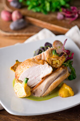 Chicken breast. Chicken pan seared to a crispy golden brown in brown butter and served with fresh organic vegetables: carrots, Brussels sprouts and green beans. Classic American restaurant favorite.