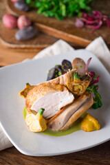 Chicken breast. Chicken pan seared to a crispy golden brown in brown butter and served with fresh organic vegetables: carrots, Brussels sprouts and green beans. Classic American restaurant favorite.