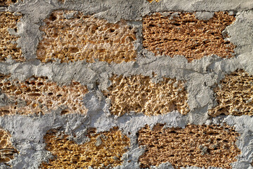 Wall of coquina (shell rock) blocks. Shell rock (coquina) is building material from ancient remains of marine animals. It is widely distributed due to its eco friendly composition and low cost