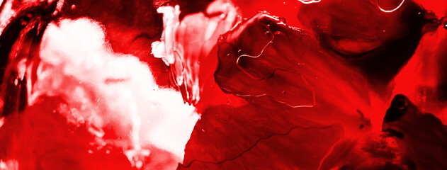 Small lemon sliced pieces in honey through glass with red filter. Juicy, bright and contrasting abstract photo banner as independent picture for interior decoration. Passion mood. Holiday background