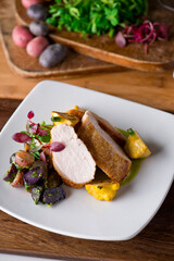 Chicken breast. Chicken pan seared to a crispy golden brown in brown butter and served with fresh organic vegetables: carrots, Brussels sprouts and green beans. Classic American restaurant favorite.