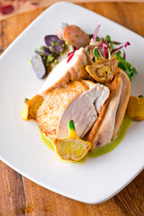 Chicken breast. Chicken pan seared to a crispy golden brown in brown butter and served with fresh organic vegetables: carrots, Brussels sprouts and green beans. Classic American restaurant favorite.
