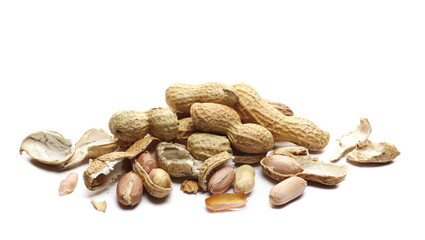 Shelled and unshelled peanuts pile isolated on white background