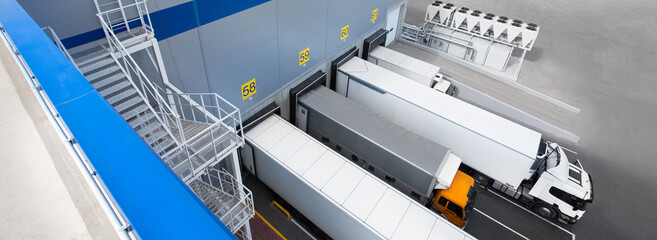 Truck while loading in a big distribution warehouse. Top view.