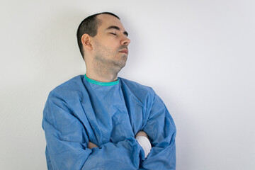 young male surgeon stand wall relax sleep health care help people exhausted