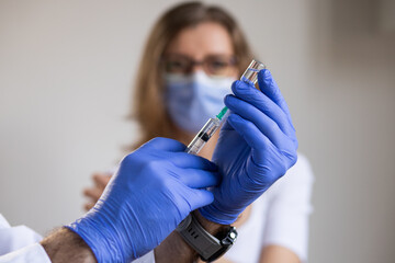 woman in risk group getting coronavirus vaccine