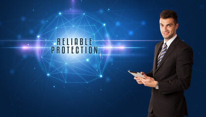 Businessman thinking about security solutions with RELIABLE PROTECTION inscription