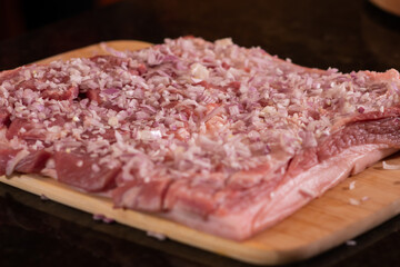 Instructional image on how to make a roasted stuffed pork loin