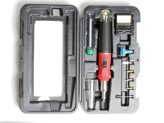 red gas soldering iron in black plastic box