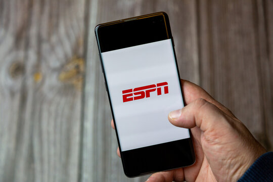 02-10-2021 Portsmouth, hampshire, UK A mobile phone or cell phone being held by a hand with the ESPN app open on screen